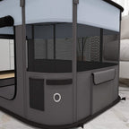 Grey foldable dog pen close-up with mesh side panels and front mesh window door