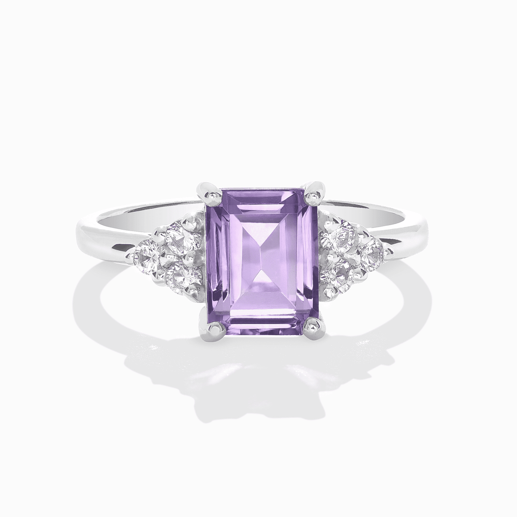 Sterling silver ring with lavender emerald-cut amethyst center and round side stones