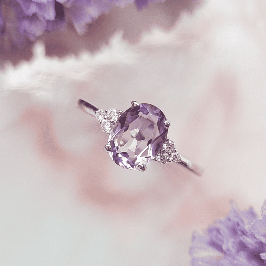 Sterling silver ring with oval lavender amethyst and small diamond side stones