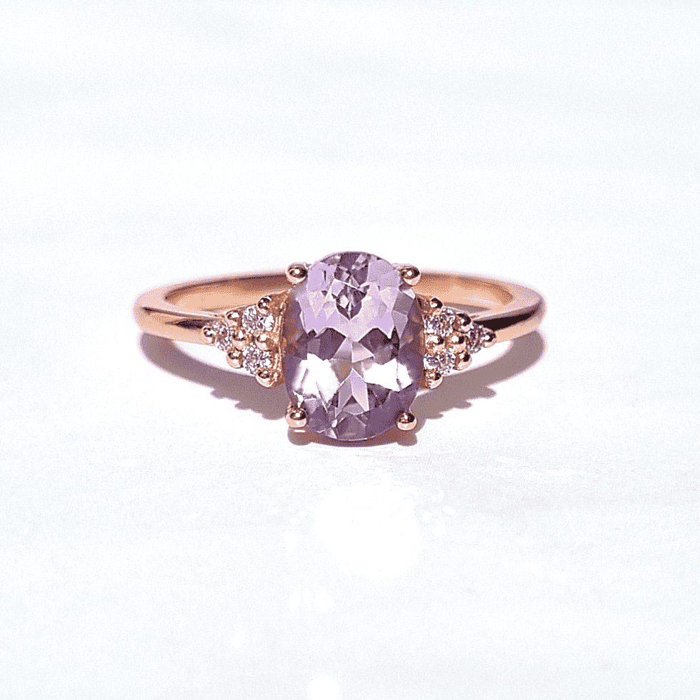 Rose gold vermeil ring with large oval lavender amethyst center and side clusters