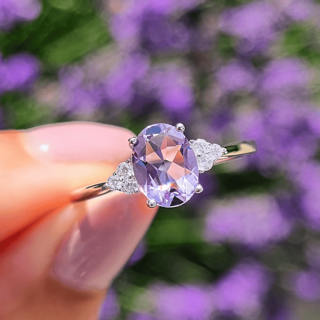 Sterling silver ring with oval lavender gemstone and diamond side sparkle accents
