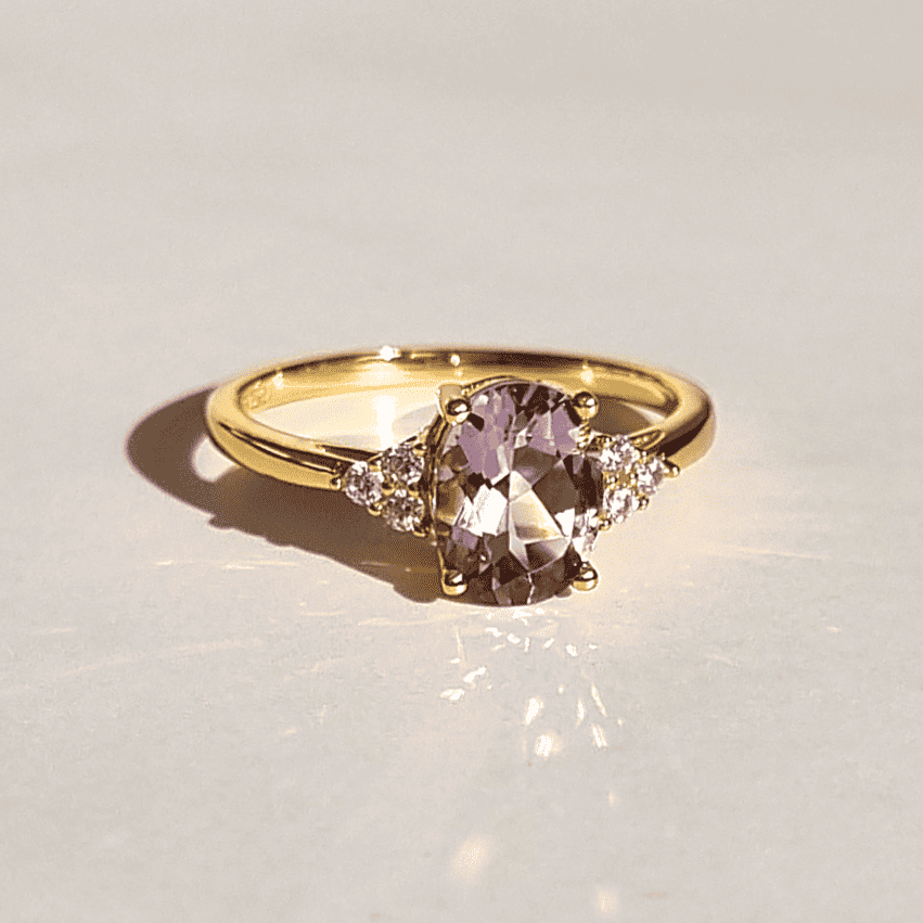 Gold vermeil amethyst ring with three small diamond-like stones on each side