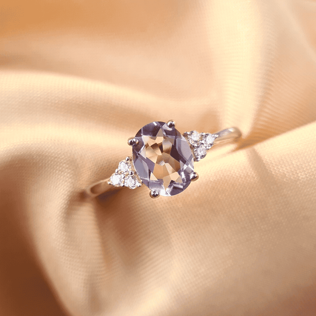 Sterling silver ring with large oval lavender gemstone and small diamond side accents
