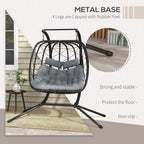 Black hanging egg chair with 4-leg metal base and gray thick padded cushion