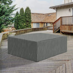 Dark gray outdoor sofa set cover fitted over a sectional-style seat on a patio.