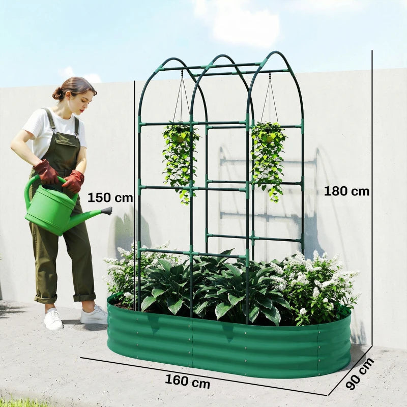 Green galvanized raised garden bed with arched trellis, planted with tall leafy greens