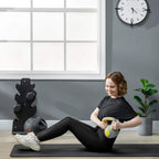 4 kg kettlebell with gray body and yellow handle in use on a workout mat