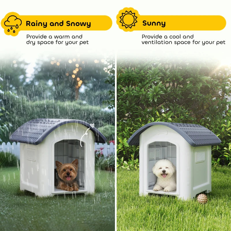 Outdoor dog kennel with dark grey roof and open door, white plastic in green yard