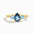 18k gold vermeil ring with blue teardrop center and round side stones