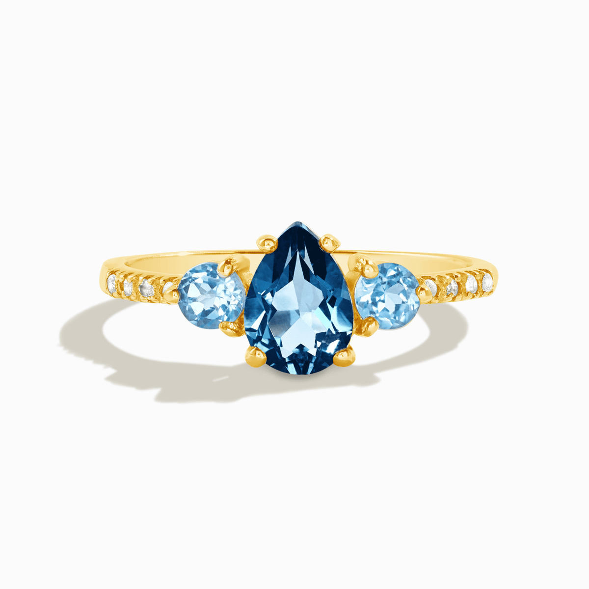 18k gold vermeil ring with blue teardrop center and round side stones