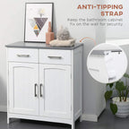 White bathroom cabinet with anti-tip wall strap and double doors, gray tabletop and metal handles
