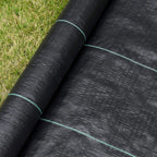 Black weed barrier fabric close-up with green guide seam lines at overlap