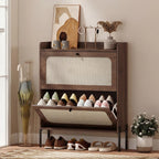 Dark brown shoe cabinet with woven front door, flip drawer open with shoes