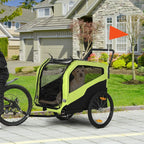 Green dog stroller/bike trailer with mesh side panels, black canopy, and large wheels