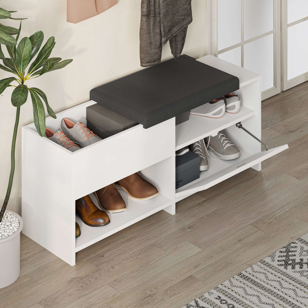 Shoe bench with black cushion, white frame, open compartments with shoes and accessories