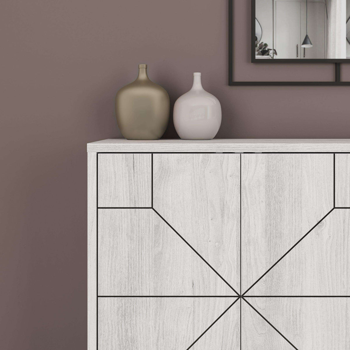 Detail of light wood-look sideboard with geometric door lines and framed panel design