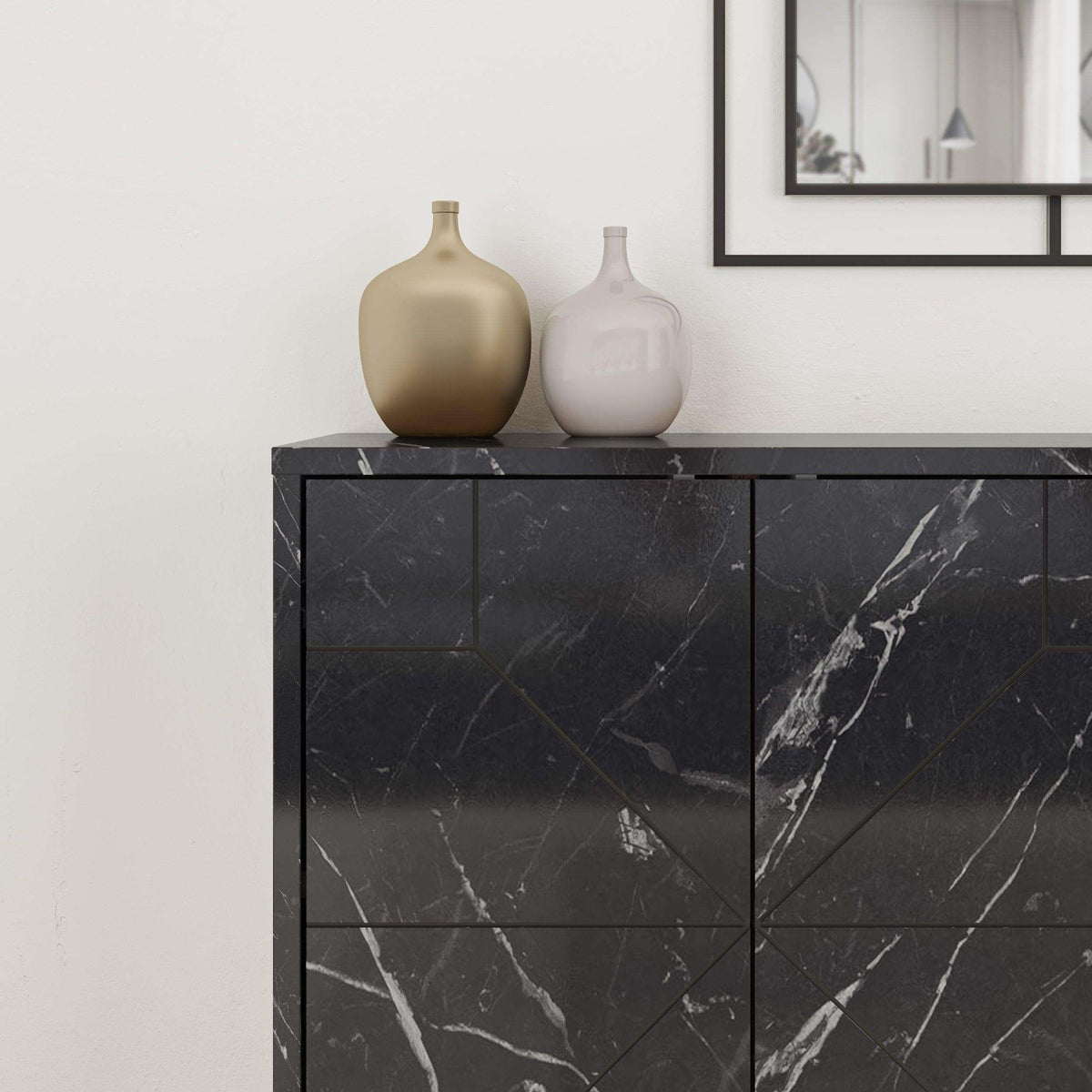 Black marble-look sideboard front with geometric door panels and top surface