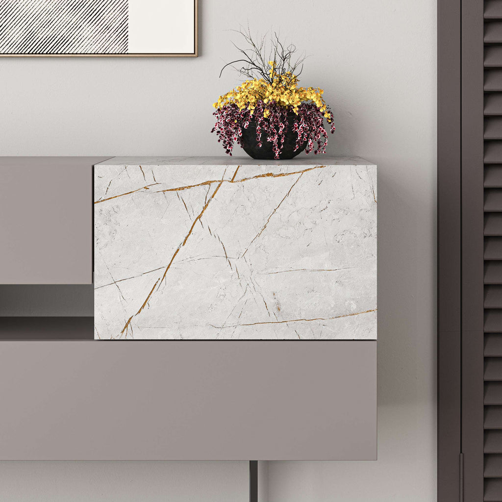 Close-up of console sideboard with white marble-look panel and grey cabinet frame