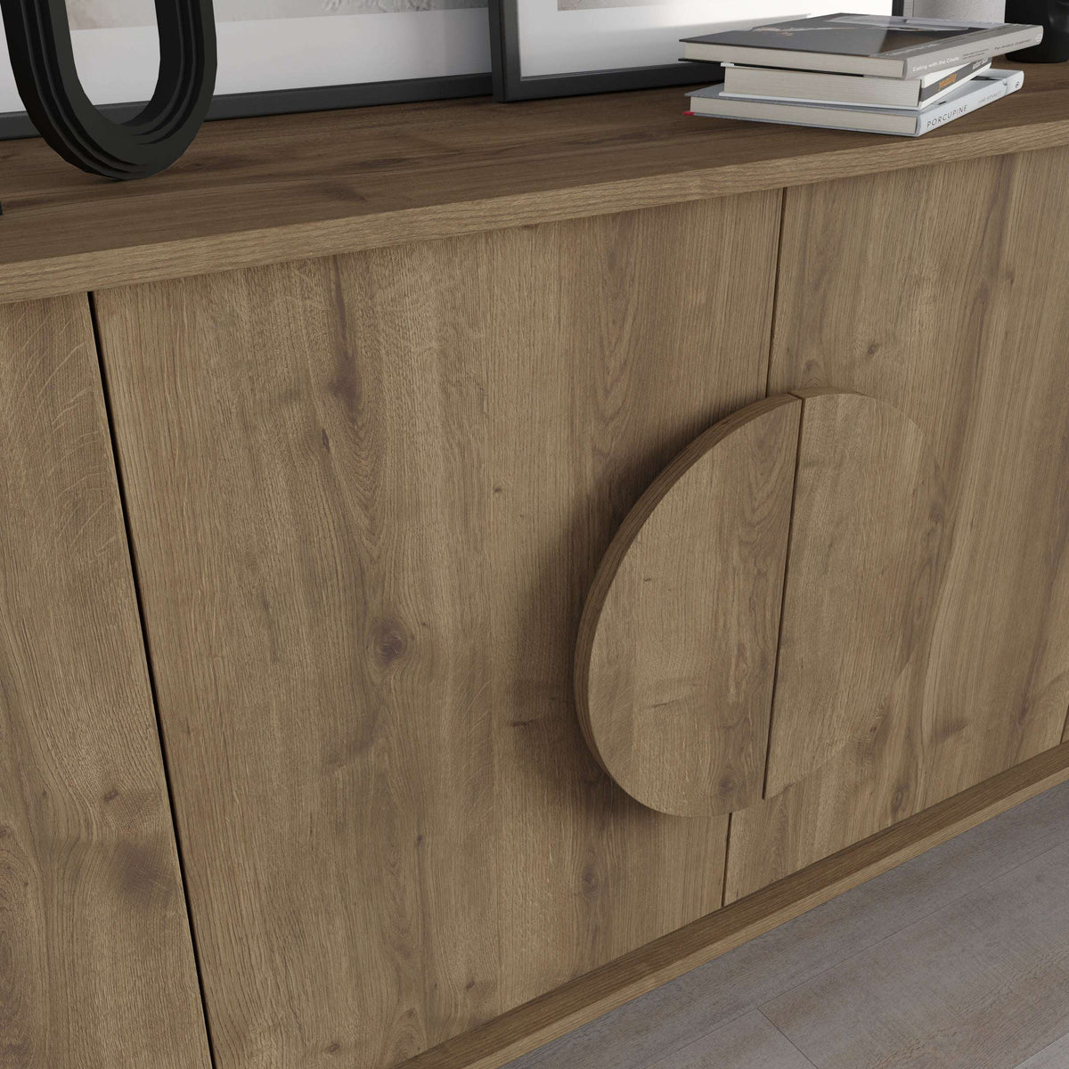 Light oak sideboard with circular cut-out handle detail on a marble-look panel edge