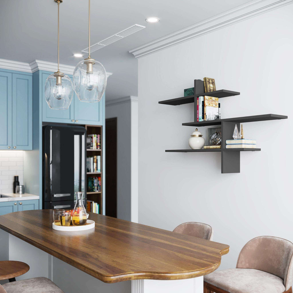 Dark floating wall shelf with three tiers, mounted above a dining area
