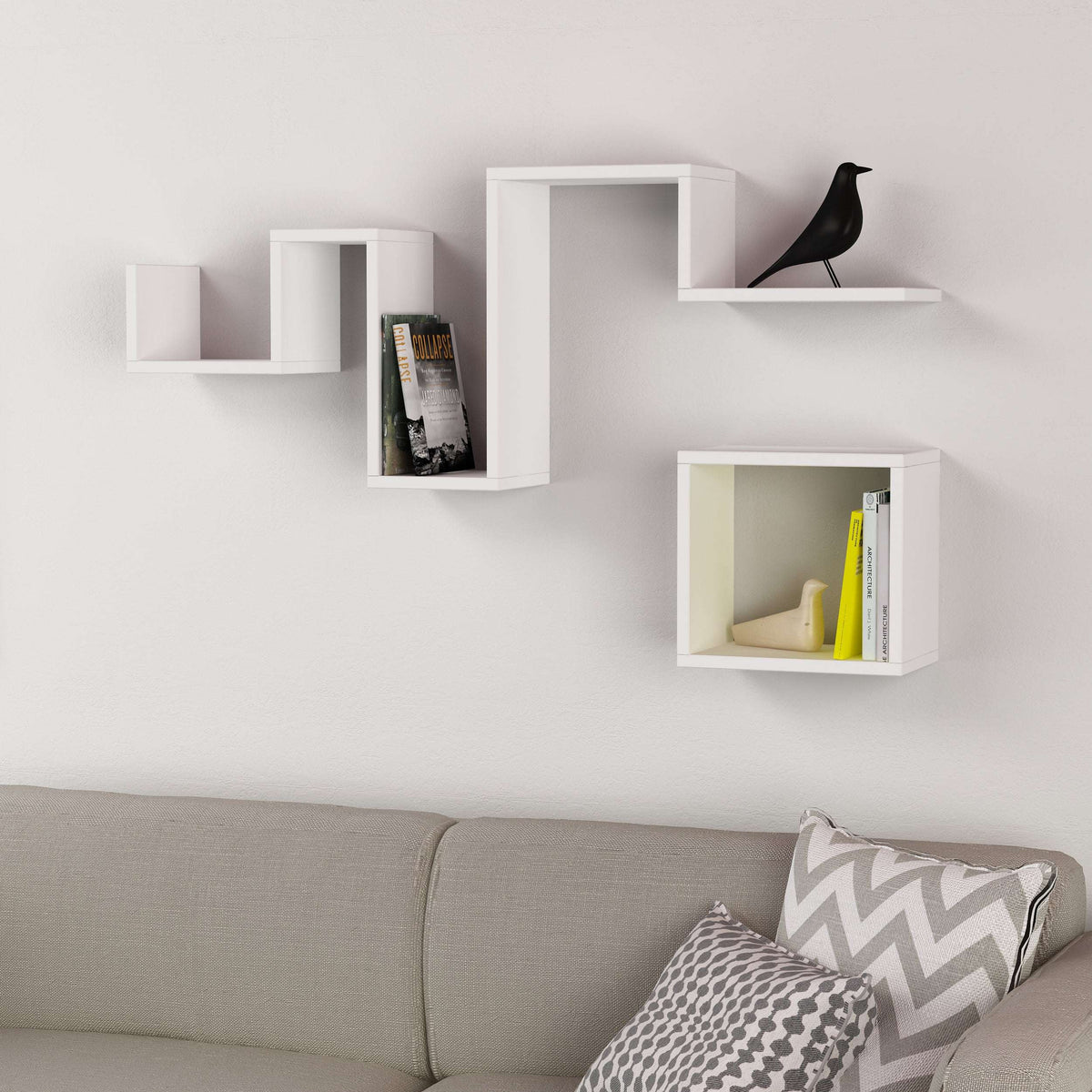 White floating wall shelf with three open compartments and modern stepped design
