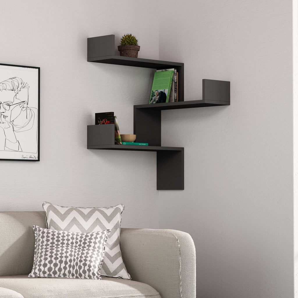 Wall-mounted corner bookcase with dark grey floating shelves and open cubby display