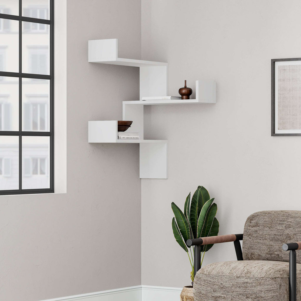 White corner wall-mounted bookcase with three open stepped shelves