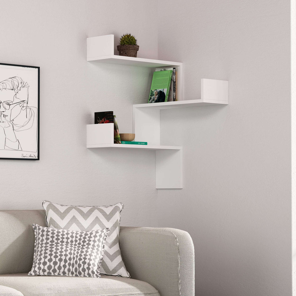 Wall-mounted corner bookcase with white floating shelves and open cubby storage