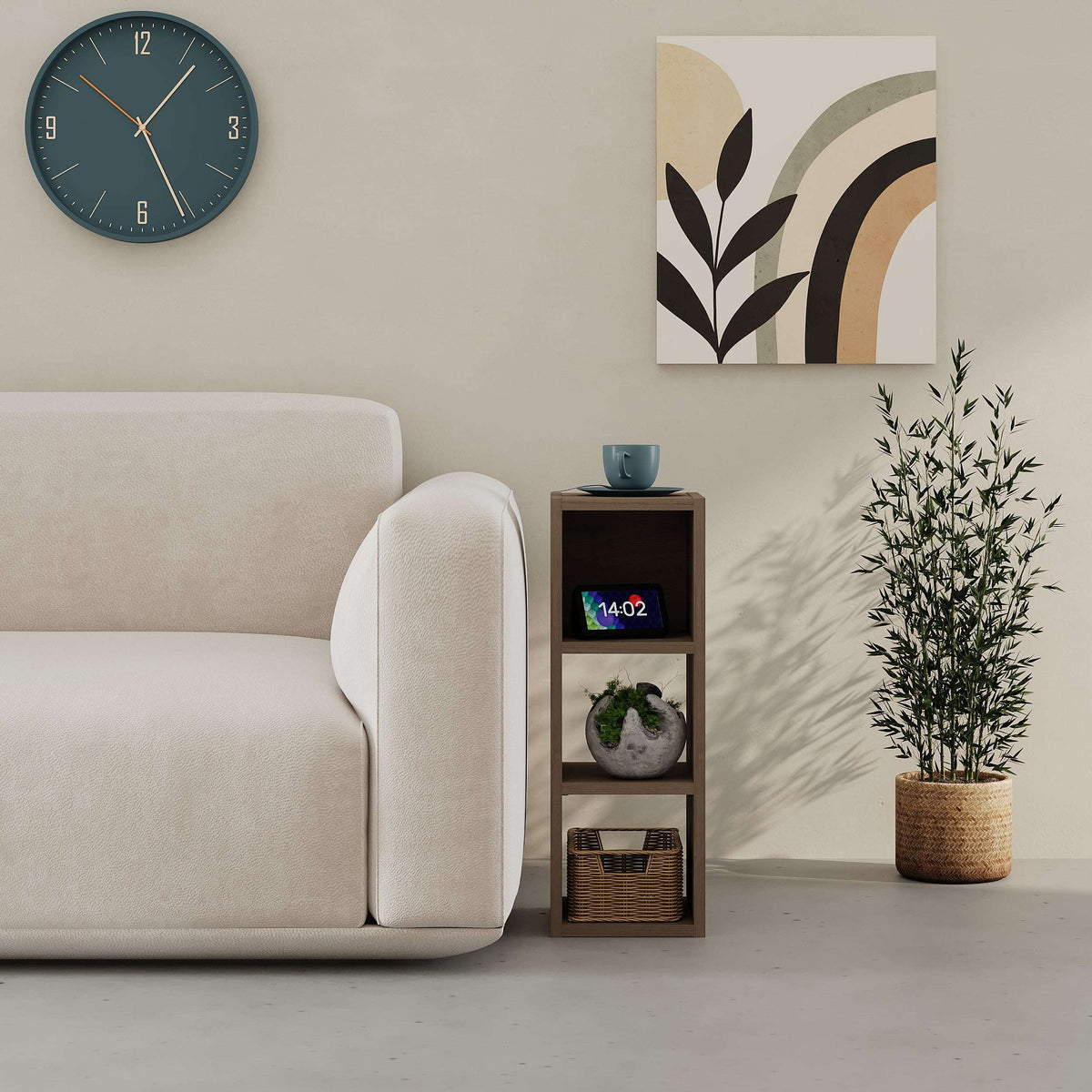 Small low standing bookcase with open cubby shelves in dark wood, shown beside a sofa