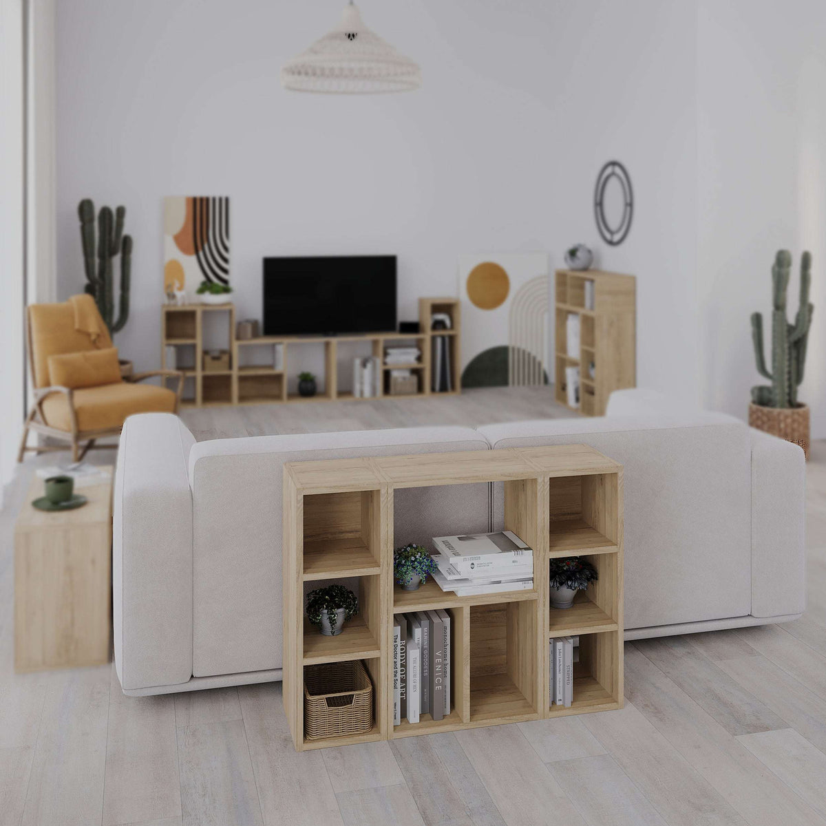 Small low modular bookcase with open cubby shelves in light wood