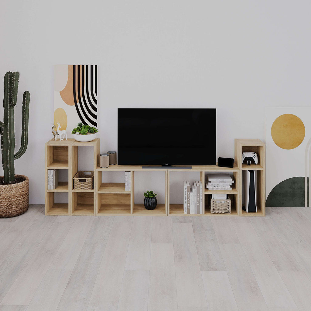 Small low modular bookcase with open cubby shelves in light wood