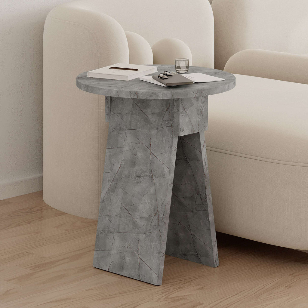 Marble-look round side table with grey veining and angled pedestal legs