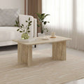 Modern coffee table, light travertine finish, 60x100 cm, chunky angled legs