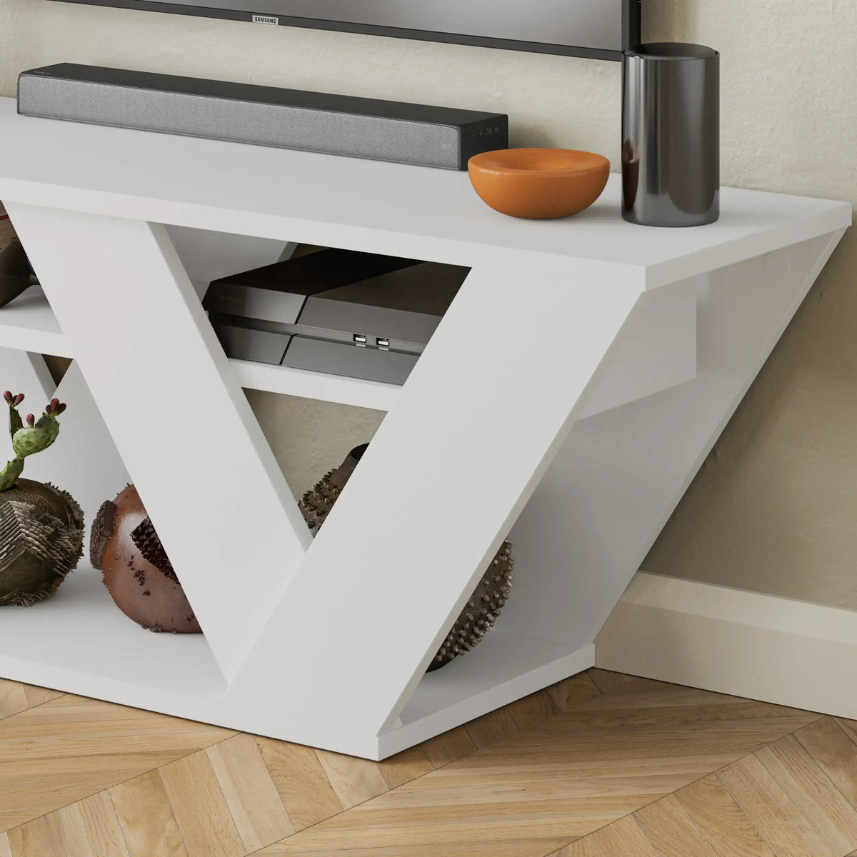 White TV stand corner view with open V shelf and sliding drawer