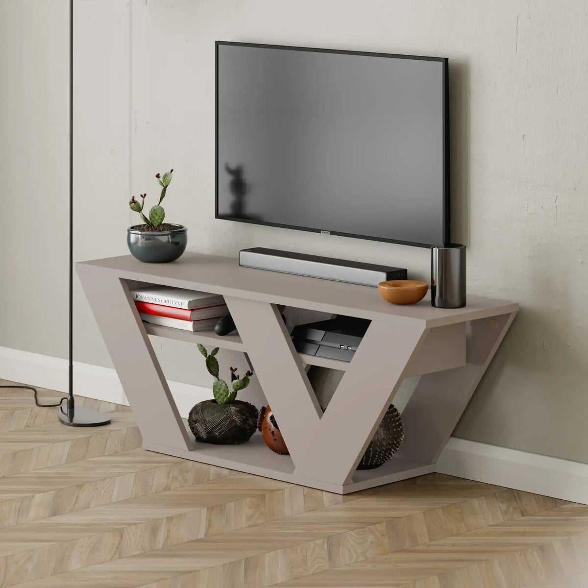 Modern TV stand with open V-shaped shelves and cable-ready center niche, light grey