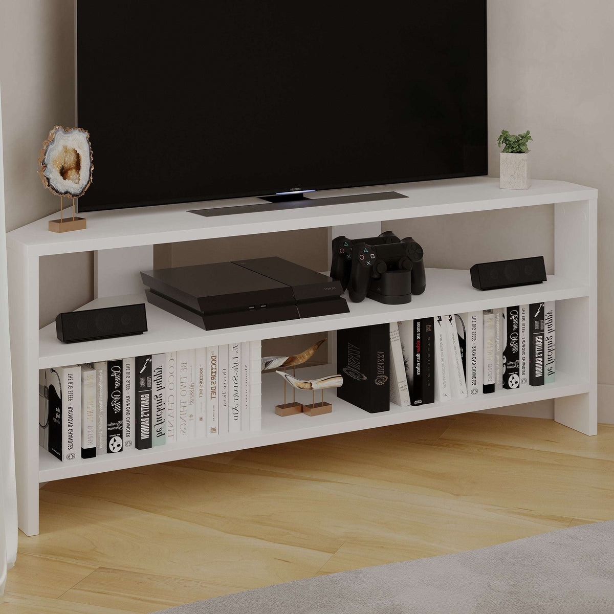 White TV media console with open shelves, center shelf, and visible gaming accessories