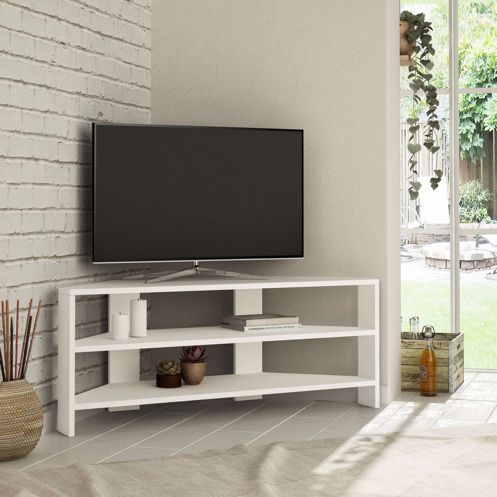 White corner TV stand with open shelves under a flat-screen TV