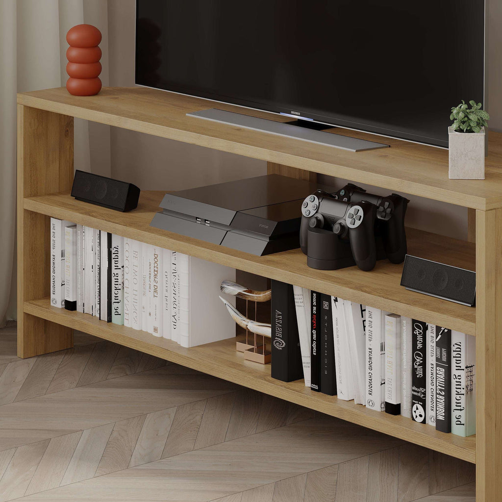 Oak TV stand with open shelving, media console space, and game controllers