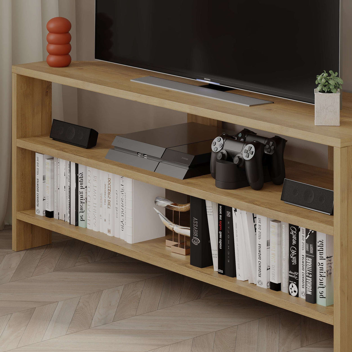 Oak TV stand with open shelving, media console space, and game controllers