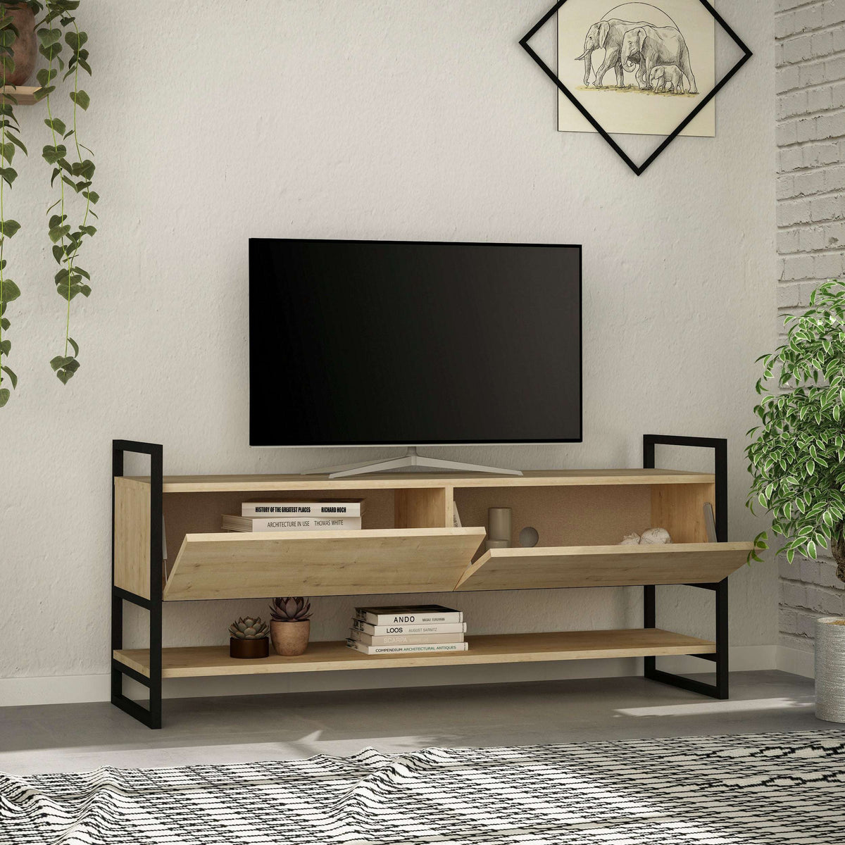 Modern TV stand in light oak with open compartments and black metal side frames.