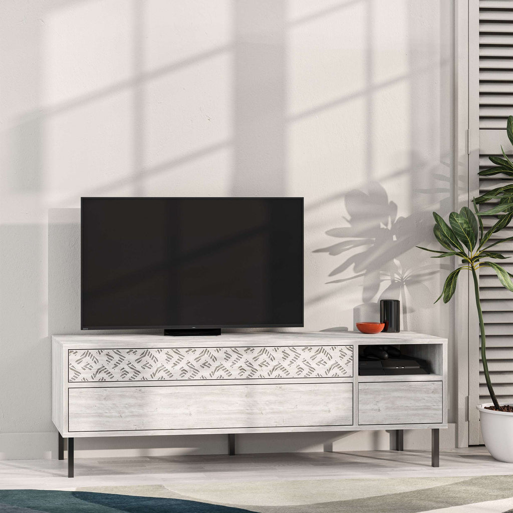 White TV stand with patterned drawer fronts, open media shelf, and side storage
