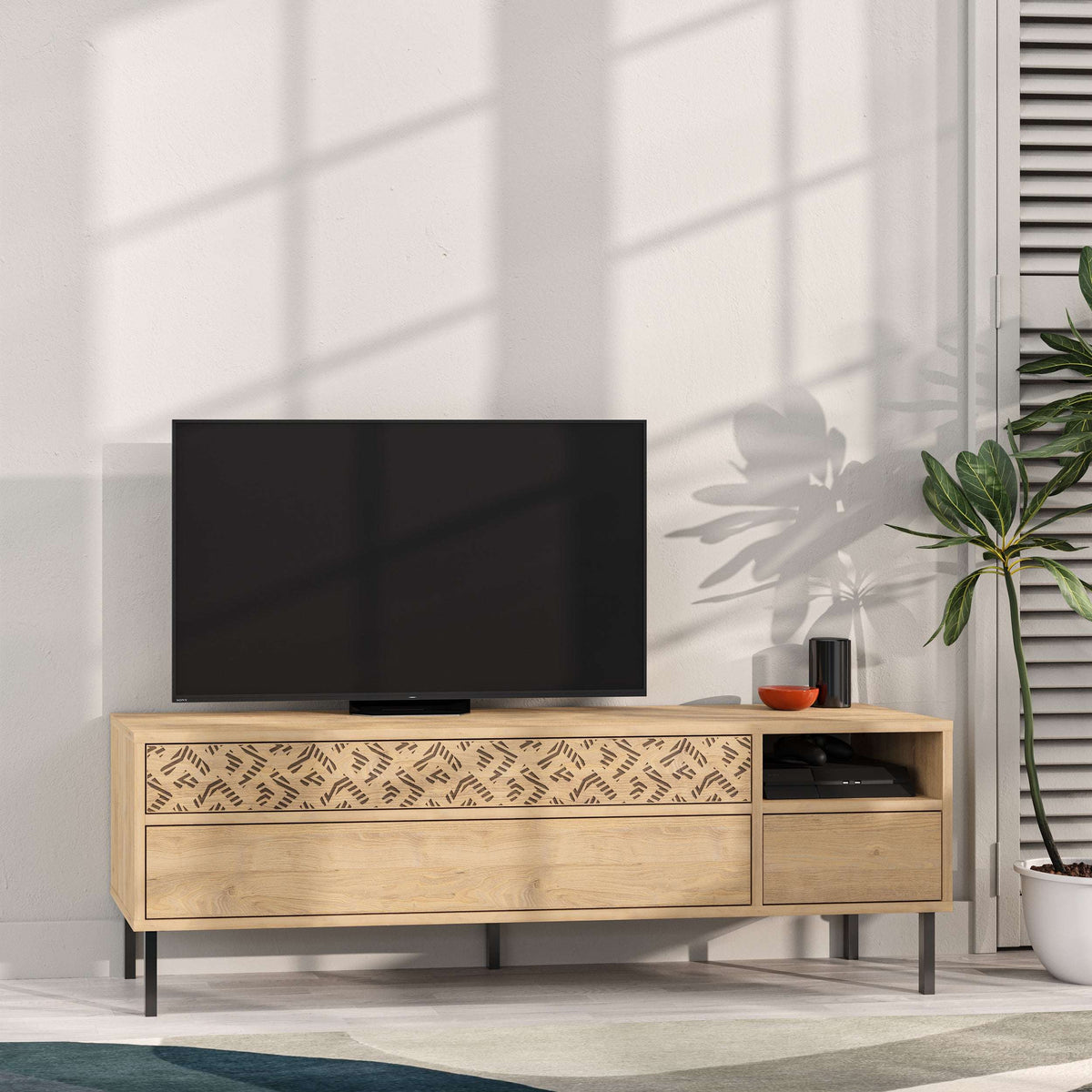 Light wood TV stand with patterned drawer front, open media shelf, and storage cabinets