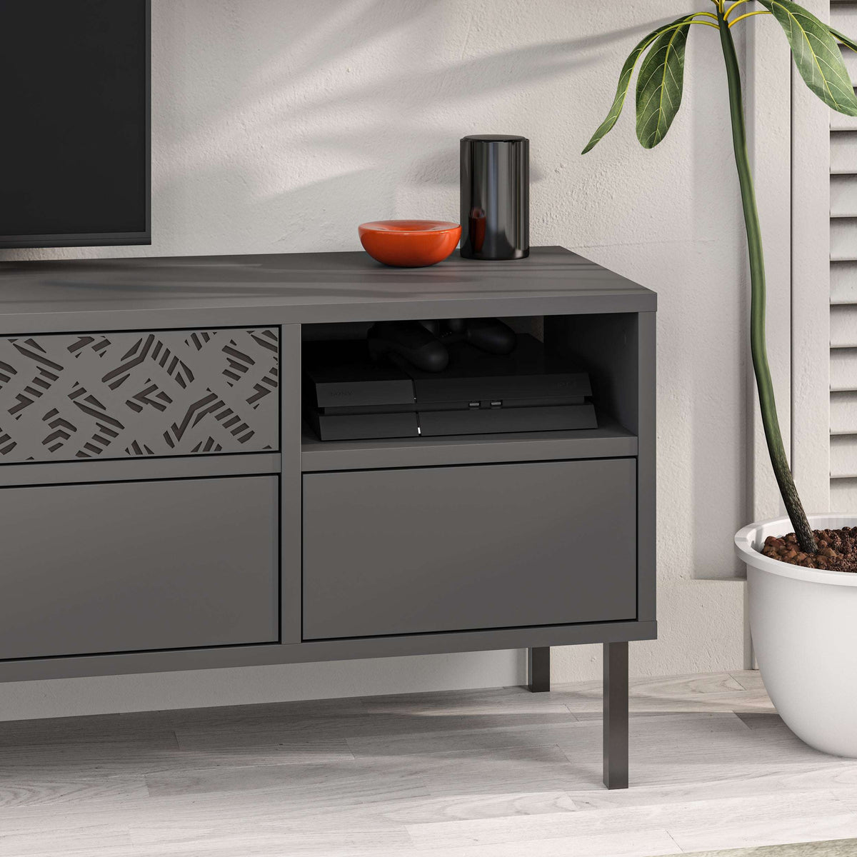 Modern dark grey TV stand with open media shelf and lower drawer cabinet
