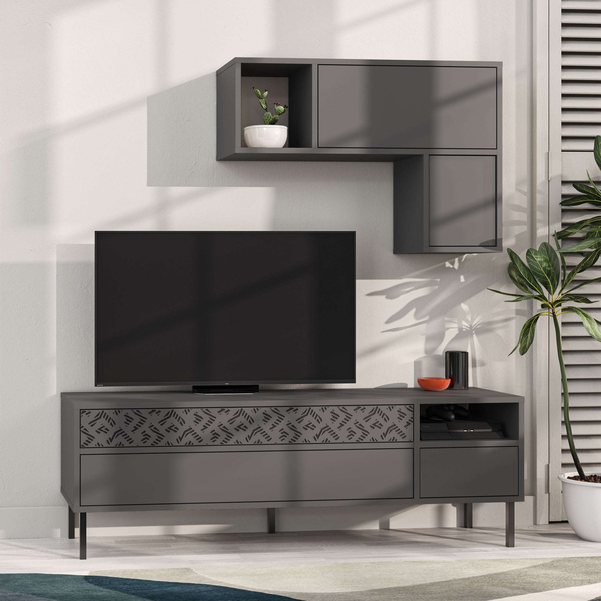 Dark gray modern TV console with storage cabinet and wall shelf, dark TV screen visible