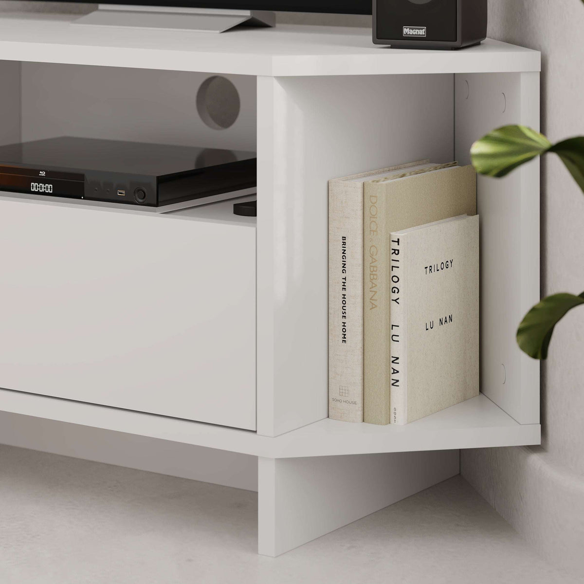 White corner TV unit corner shelf with books in open compartment