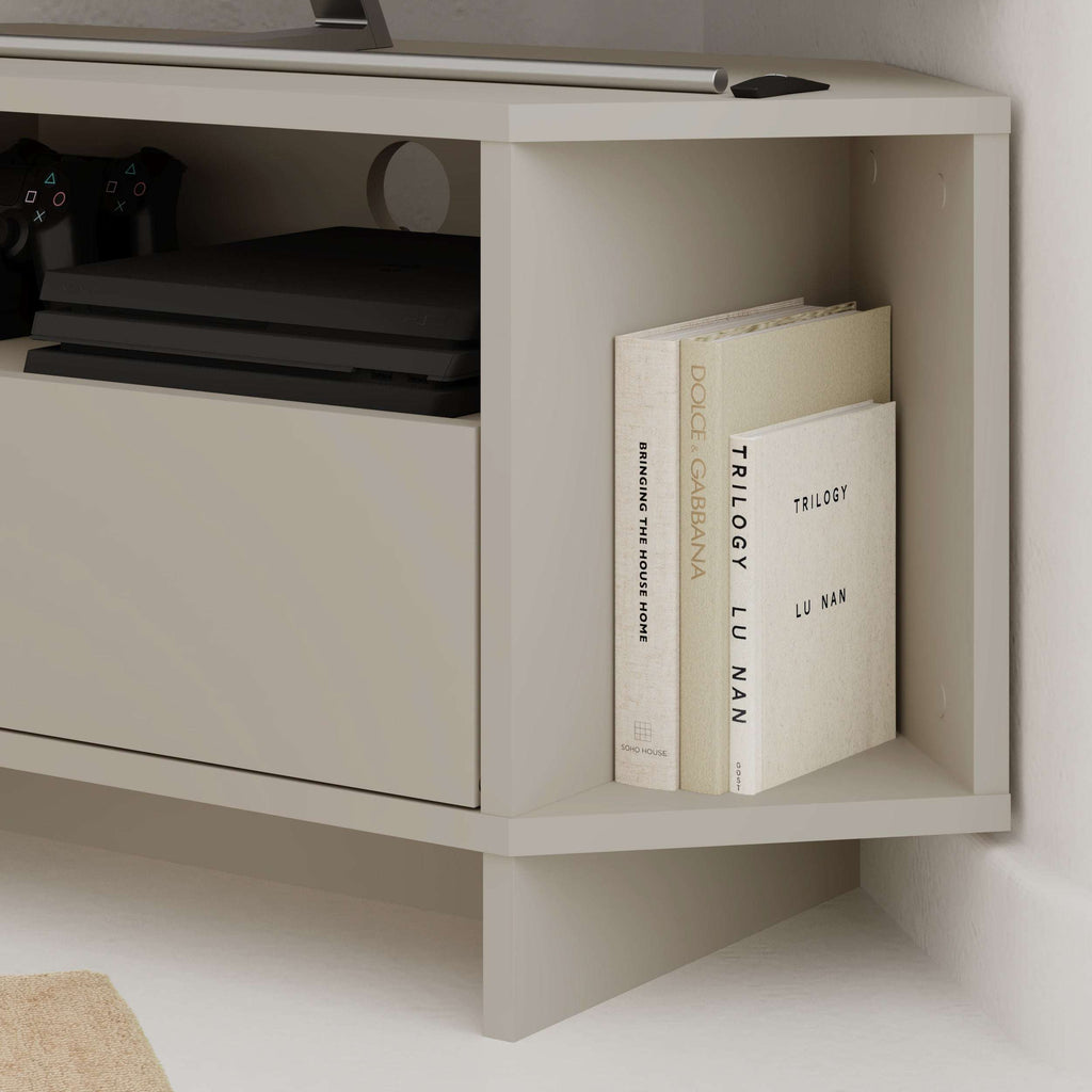 Corner TV unit cabinet with open shelves, featuring books and devices, white finish.