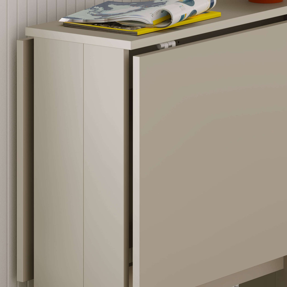 Foldable dining table side view with smooth sandstone beige panels and thick frame.