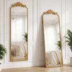Full length mirror with ornate baroque gold frame, two angles against paneled wall