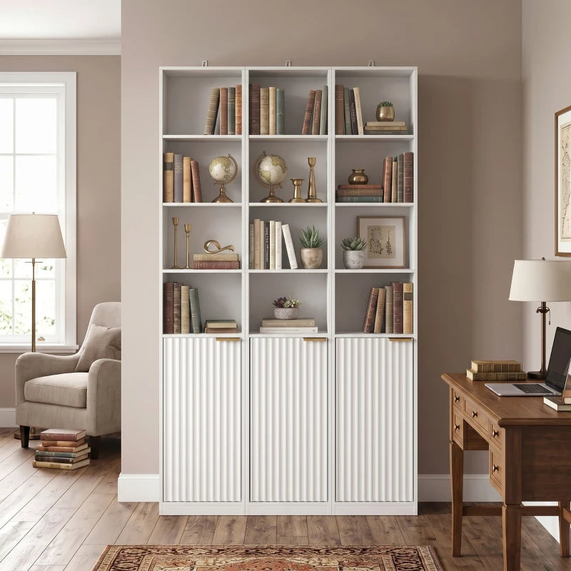 White wood-effect bookcase with multiple cubbies and ribbed lower storage cabinet