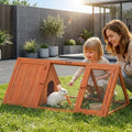 Orange wooden rabbit hutch with wire mesh and swinging doors